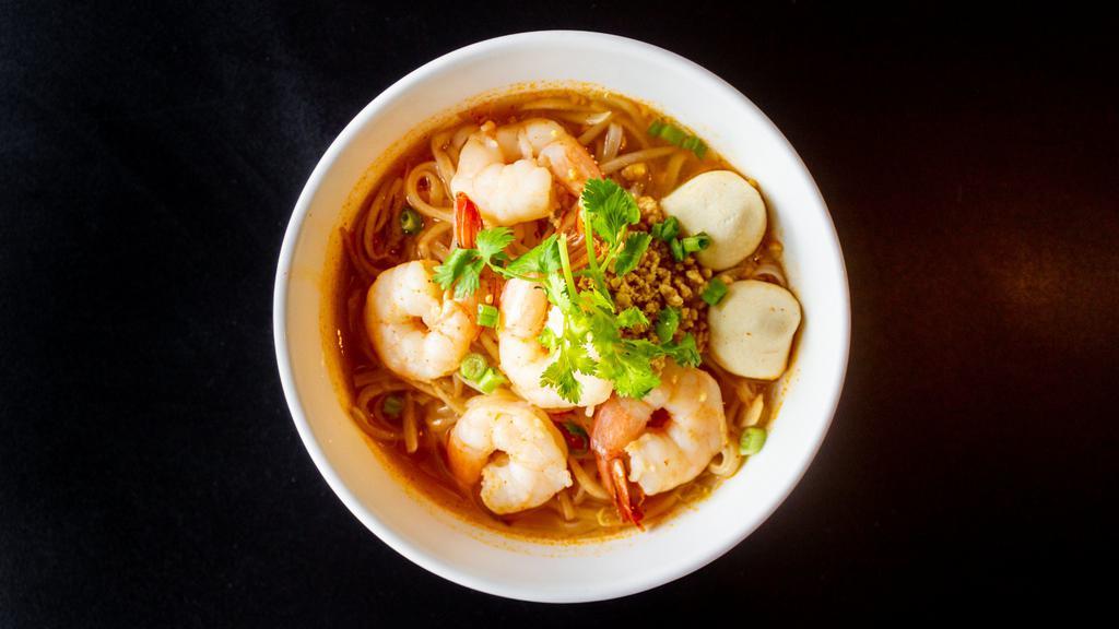 N-4. Tom Yum Noodle Soup · With rice noodles, fish ball, bean sprouts, scallions, cilantro, ground peanut, and fried garlic in tom yum soup.