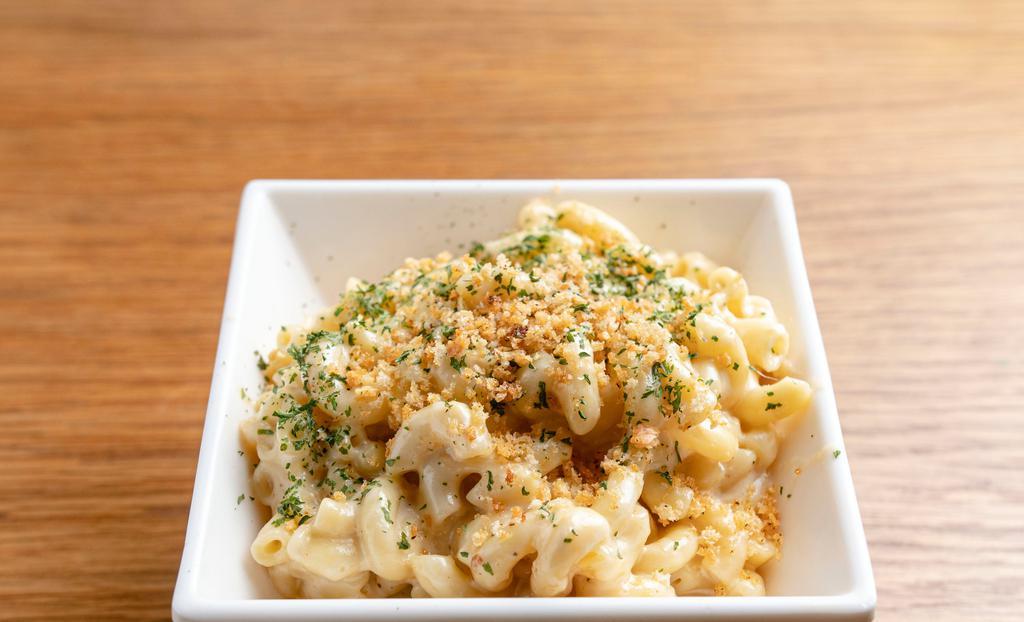 Mac & Cheese · Emmental, Swiss and cheddar based cheese topped with bread crumbs.