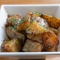 Yukon Gold Roasted Potatoes · Yukon gold roasted potatoes seasoned with herb de provence. Extra virgin oil.