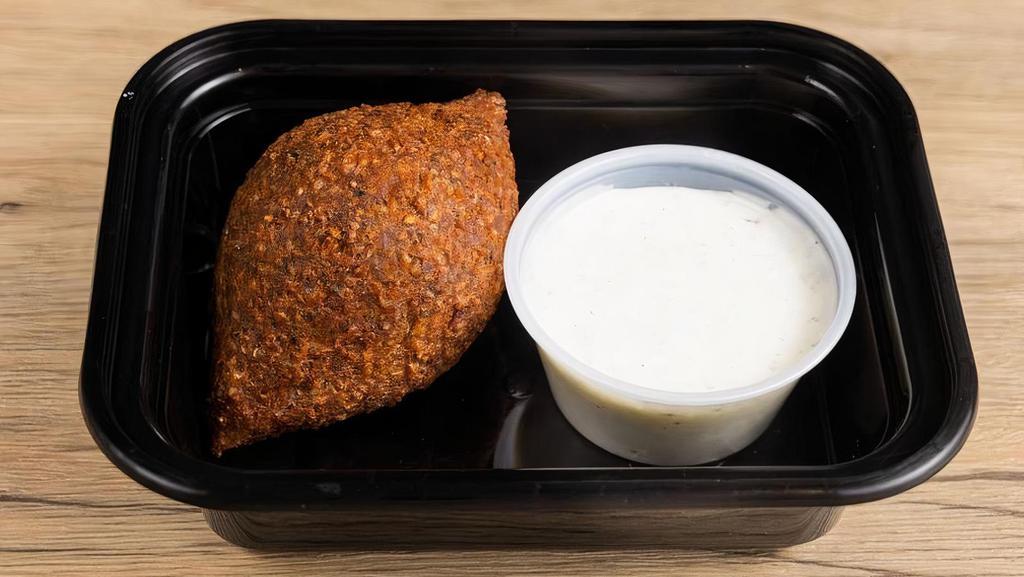 Kibbeh (1 Pc) · Spiced beef dumplings with pine nuts, onion and cracked wheat (bulgur).