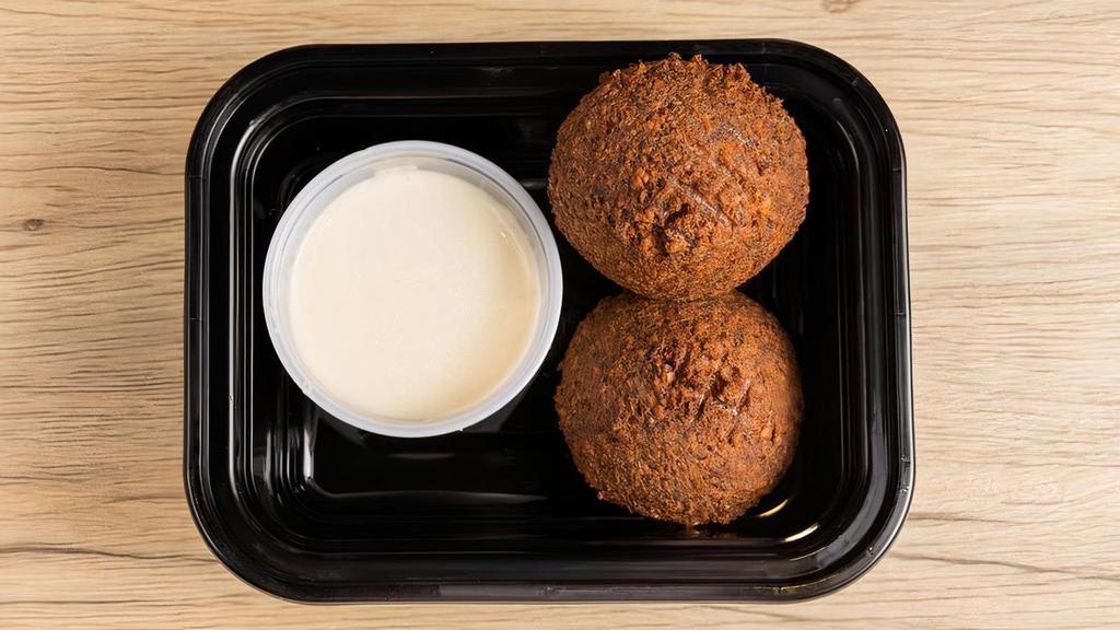 Falafel (1Pc) · Chickpea and fava bean croquette mixed with herbs, spices, pepper and onion.