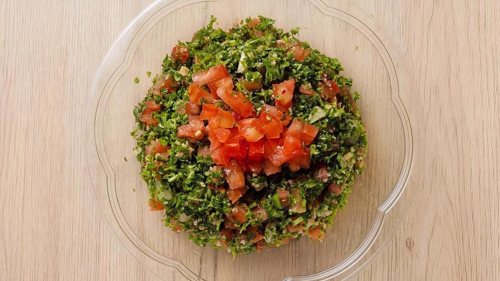 Tabbouleh · Parsley and cracked wheat (bulgur) with tomato, mint, onions, lemon and olive oil.