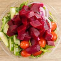 Beet Salad · Fresh beets, arugula, cucumber, tomato and red onions with a lemon and olive oil dressing.