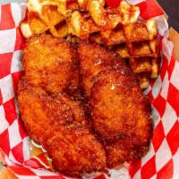 Chicken & Waffles  · two hot belgium waffles, four fresh hand battered chicken breast, served with hot syrup