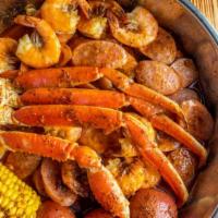 Low Country Boil · Half pound shrimp (no head), half pound snow crab legs, half pound sausage, corn & potato.