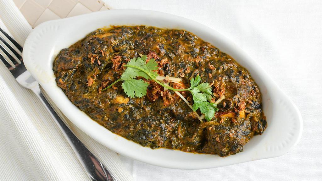 Saag Paneer · Spinach and homemade cheese with a little curry sauce.