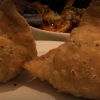 Meat Samosa · 2 Pieces. Crisp patties stuffed with minced meat and peas with a little spice.