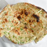 Garlic Nan · Leavened bread, baked in tandoor with garlic and butter.