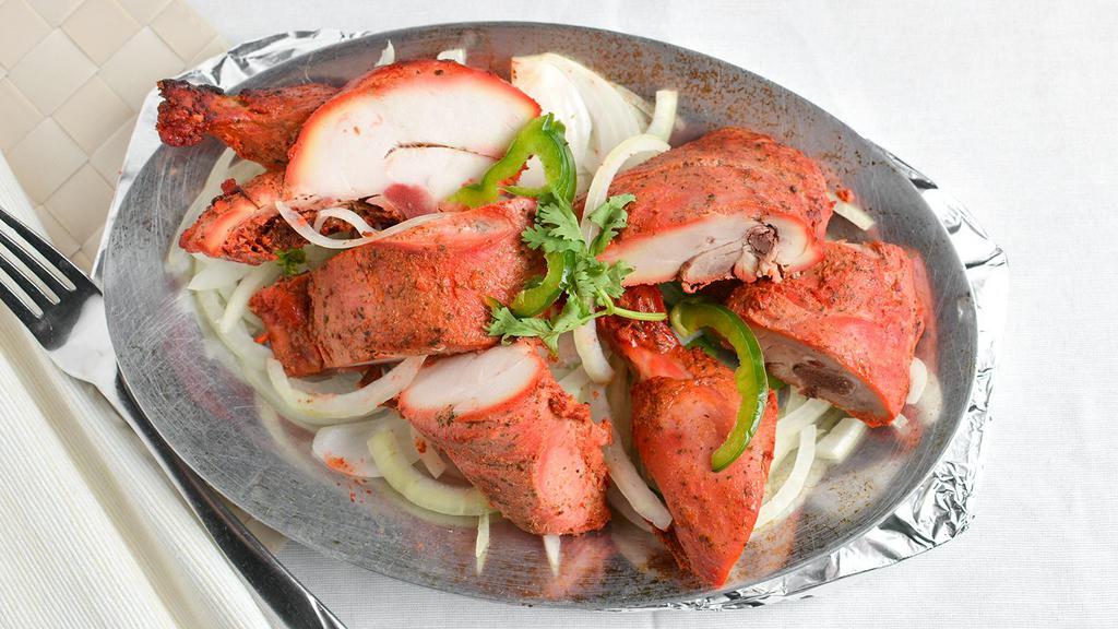 Chicken Tandoori · Chicken marinated in yogurt. garlic, ginger, vinegar and indian spices.