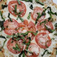 Napolitano Pizza For Two · Fresh mozzarella base, fresh tomato, basil, and olive oil.