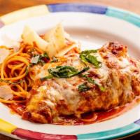 Chicken Parmigiano · Fresh tomato and basil sauce served with spaghetti.