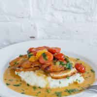 Roasted Chicken · Marinated, oven roasted chicken breast with roasted tomato, capers, mashed potatoes, and gra...