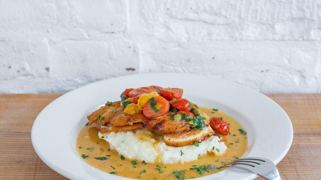 Roasted Chicken · Marinated, oven roasted chicken breast with roasted tomato, capers, mashed potatoes, and gravy.