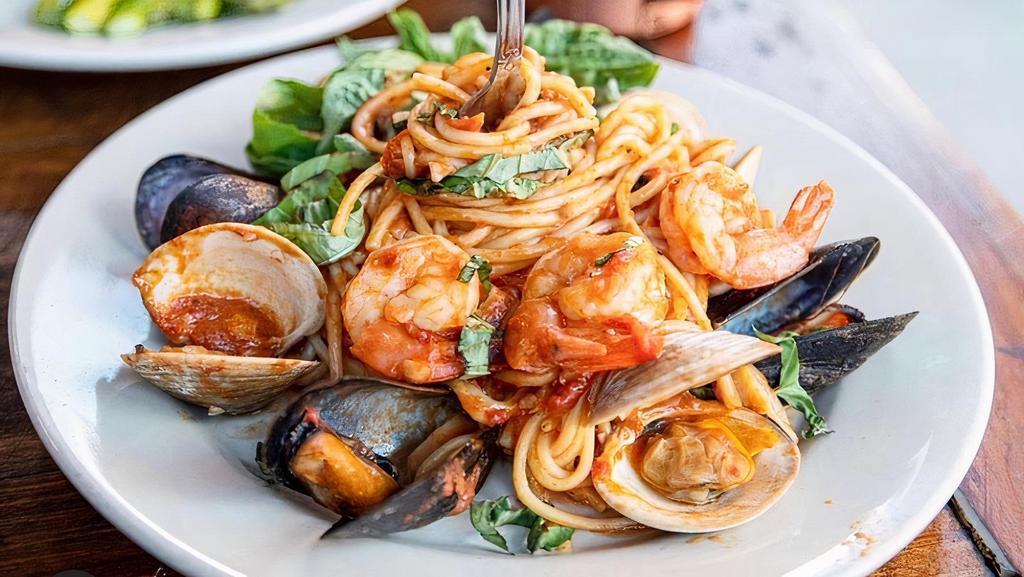 Pasta Pescatore · Clams, mussels, shrimp, and calamari with your choice of homemade marinara or alfredo sauce, parmigiano.