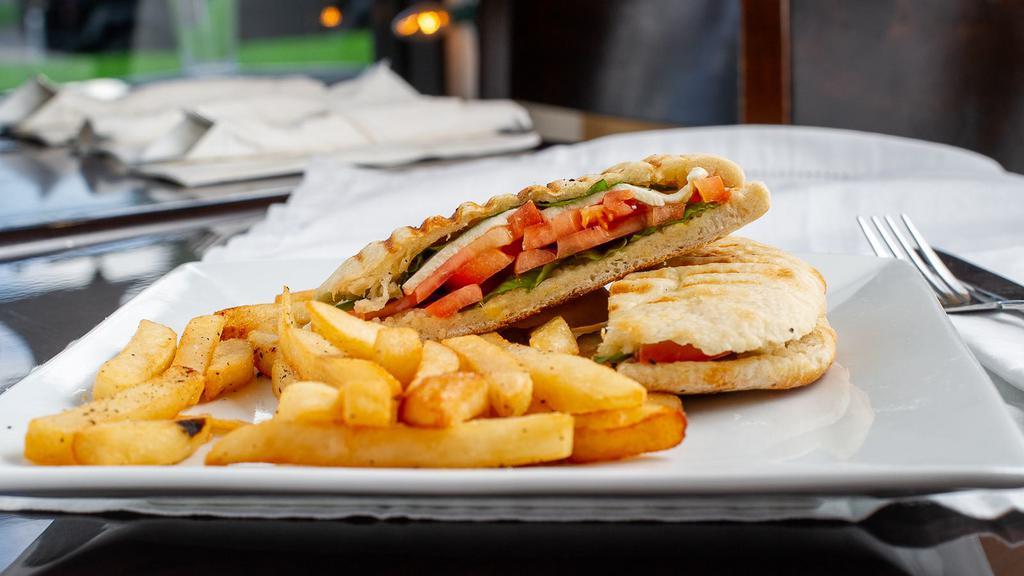 Caprese Panini · Fresh mozzarella, tomato, basil and extra virgin olive oil. Fresh grilled focaccia, side of sweet potatoes fries or fries.
