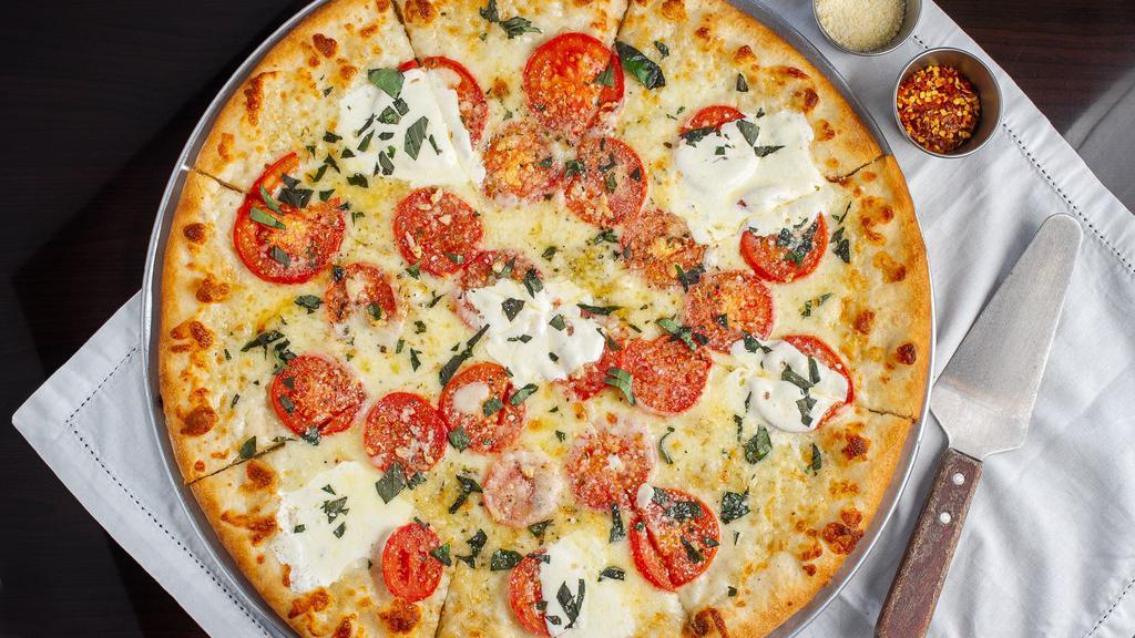 Margherita Pizza 12'' (Serves 2) · Vegetarian. Fresh tomatoes, fresh garlic, extra virgin olive oil, and fresh mozzarella.