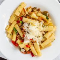 Pasta Calabrese · Rigatoni, crumbled sausage, grilled chicken, hot cherry peppers, green peas and mushrooms in...