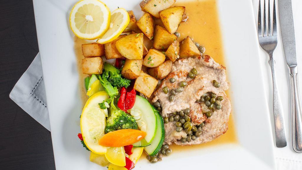 Veal Picatta · Served with capers in a lemon and white wine sauce. Served with daily vegetables and roasted potatoes.