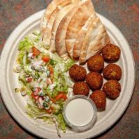 Falafel Patties · Served with tahini sauce and pita bread, salad.