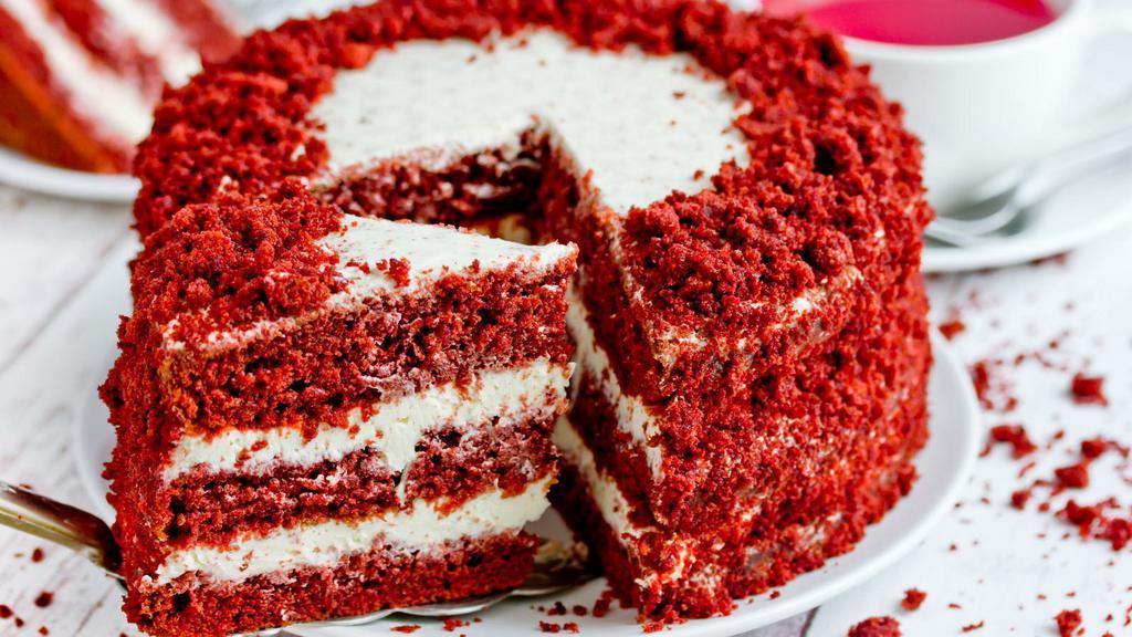 Red Velvet Cake · Rich Red Velvet Cake Slice Topped with Cream Cheese Frosting.