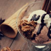 Ice Cream Sundae · Ice Cream Sundae with Chocolate Syrup, Whipped Cream & Nuts.
