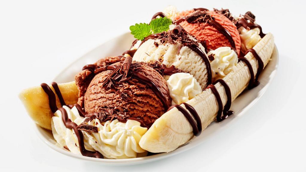 Banana Split · Three delicious scoops of ice cream and one banana decorated with chocolate syrup, strawberries, whipped cream and fresh walnuts.