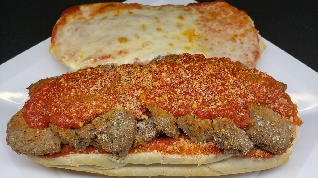 Meatball Sub - Large · Our homemade meatballs sliced and stacked on a sub roll. Layered with marinara sauce and grated cheese. Large is 12