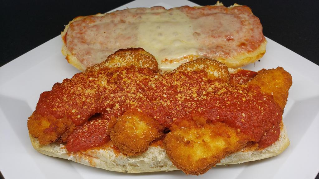 Chicken Parm Sub - Large · Our Chicken Parm  sub includes mozzarella, grated cheese and our signature marinara sauce. Large is 12