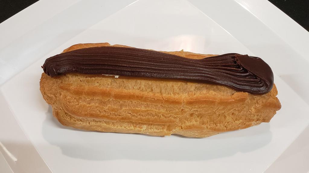 Eclairs · A large Eclair filled with our homemade custard and topped with chocolate fudge.