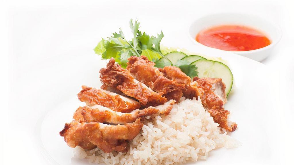 Crispy Fried Chicken Bowl · (GAI-TODD) Crispy boneless chicken thigh with ginger rice, lettuce, tomato, cucumber & a side of Sweet chili sauce