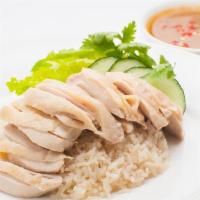 Steamed Dark Meat Bowl · (KHAO-MAN-GAI) . Traditional steamed boneless chicken thighs with ginger rice, lettuce, toma...