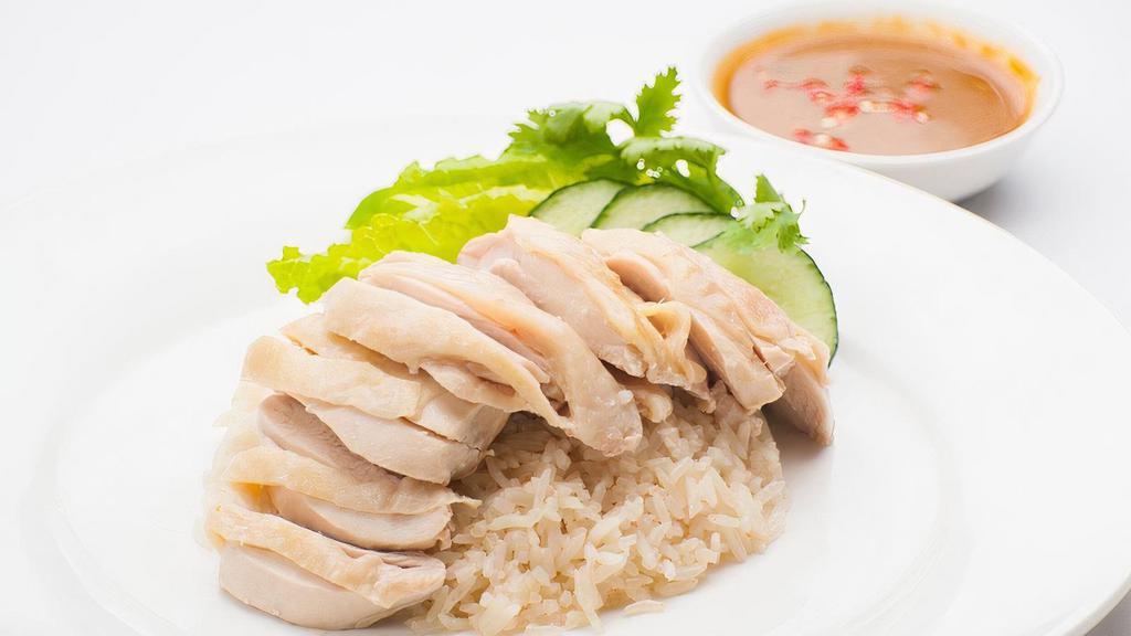 Steamed Dark Meat Bowl · (KHAO-MAN-GAI) . Traditional steamed boneless chicken thighs with ginger rice, lettuce, tomato, cucumber & a side of our Ginger chili sauce