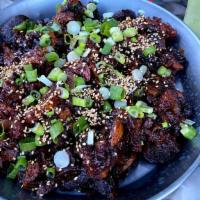 Spicy Jokbal (매운 족발) · Spicy Pig's trotters. Served w. Ssamjang sauce, lettuce, jalapenos & fresh garlic.