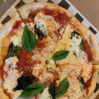 Margherita Pizza · Classic Neopolitan pizza. San Marzano tomatoes, fresh mozzarella & basil.