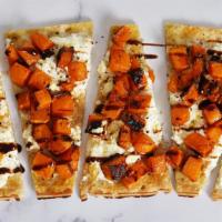 Butternut Squash · Our classic flatbread topped with butternut squash, ricotta cheese, and drizzled with balsam...