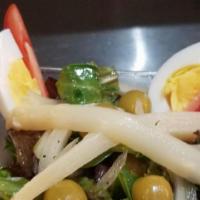 Ensalada Espanola · Romaine lettuce, tomatoes, onion, green olives, hard boiled egg white asparagus oil and vine...