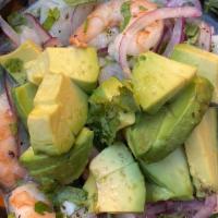 Ceviche · Fish or shrimp, red onions, avocado, lime and chips.