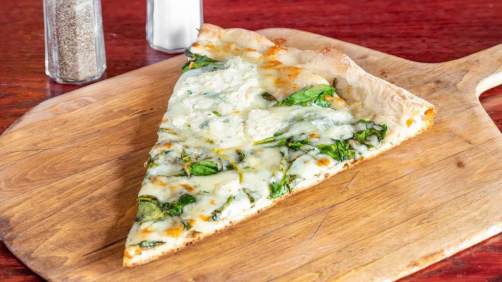 Popeye White Pizza · Spinach, ricotta, garlic and mozzarella.