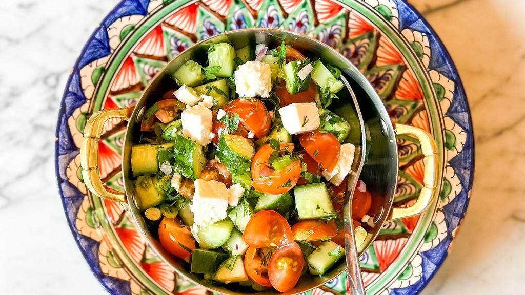 Chopped Salad  · cucumber, tomato, olives, red onion, feta, chickpea carrot sherry vinaigrette