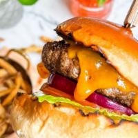 Prime Beef Burger · cheddar cheese, pickle, LTO, chipotle aioli served with Petite House Salad