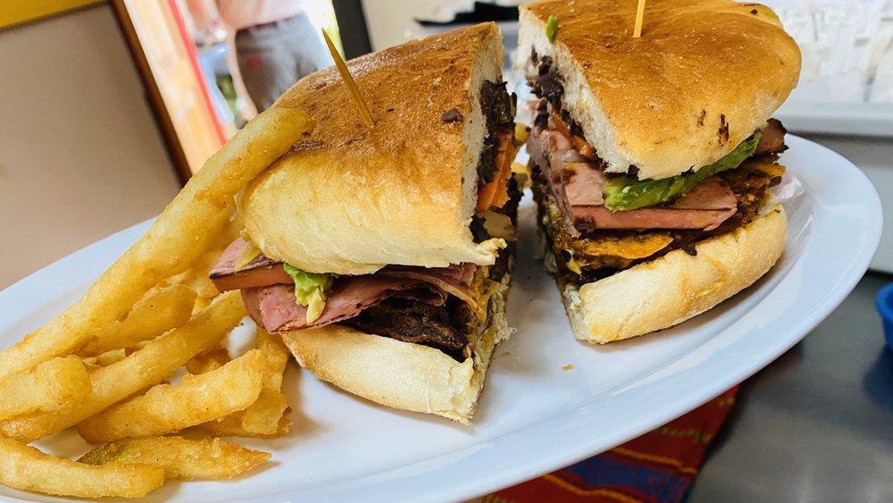 Tortas | Sandwiches · A Mexican-inspired sandwich featuring a choice of Meat with beans, mayo, lettuce, tomato, onions, avocado, peppers, and cheese. Choice of Meats: Ham, Hotdog, Breaded Beef, Mexican Sausage.