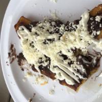 Plantains · Sweet Plantains with refried beans and sour cream.