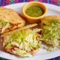 Gorditas · 3 Handmade chunky corn tortillas stuffed with your choice of Meat. Served with lettuce, pico...