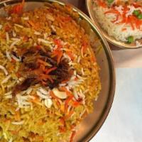 Chicken Biryani · Basmati rice with cubes of chicken cooked with saffron, onions, ginger, garlic, dried fruits...