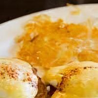 Eggs Benedict · Two Poached Eggs, Canadian Bacon & Hollandaise Sauce on an English Muffin, served with Potat...