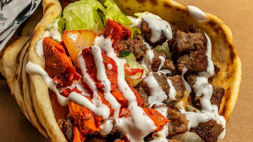 Combo Gyro Chicken And Lamb · Served on pita with salad and Shah's sauces.