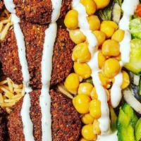 Falafel Over Rice Platter · 6 piece falafel served on rice plate with topping and sauces of your choice. Served over bro...