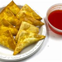 Crab Rangoon · Eight pieces, service with sweet and sour sauce.