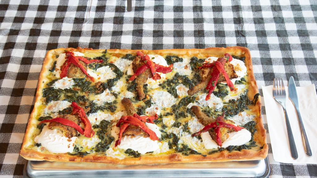 Angie Whole Pie · A stuffed artichoke on a cream of spinach with ricotta cheese and topped with homemade roasted peppers.