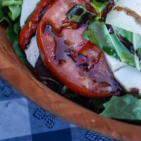 Caprese Salad · Homemade fresh mozzarella, tomato & basil over a bed of mesclun & creamy balsamic vinaigrett...